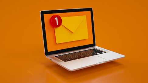 Orange envelope notification on laptop screen