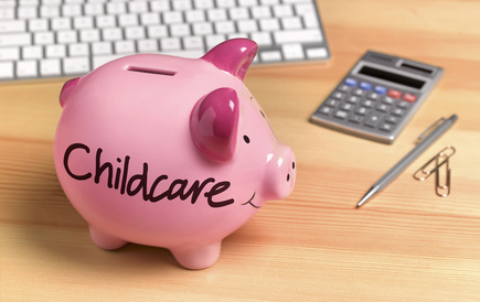 Piggy bank with childcare written on side
