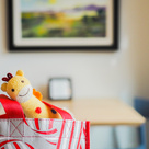 Giraffe toy sticking out of bag