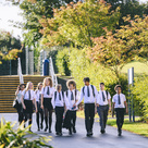Group of secondary school age children walking together