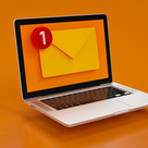 Orange envelope notification on laptop screen