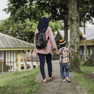 Mother and child walking hand in hand 