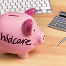 Piggy bank with childcare written on side