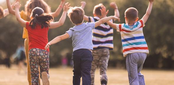 Children running away playing outside Children running away playing outside